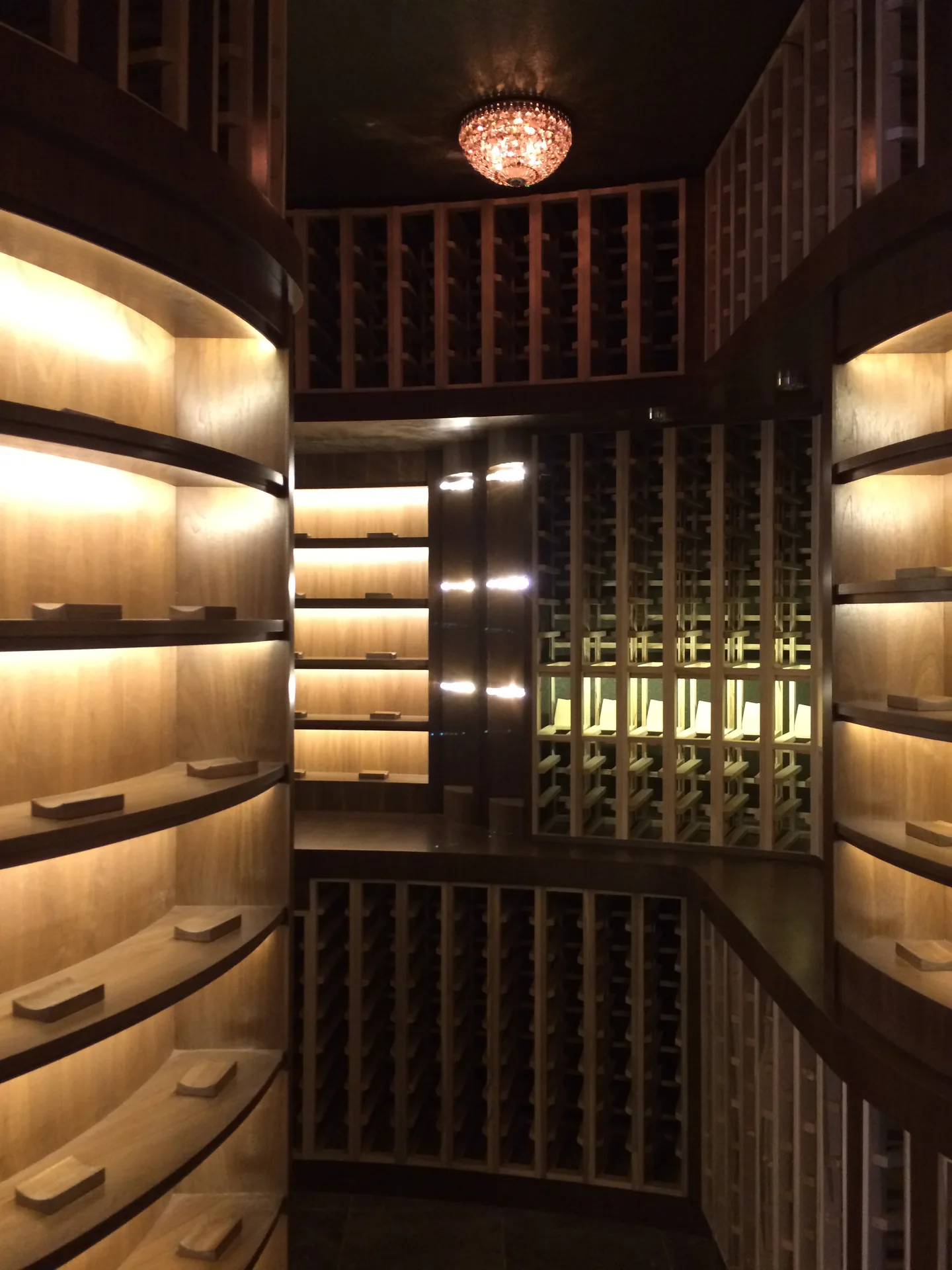 The Castle Pines Curved Timber Cellar, a 1,424-bottle wine cellar in a Castle Pines, CO residence